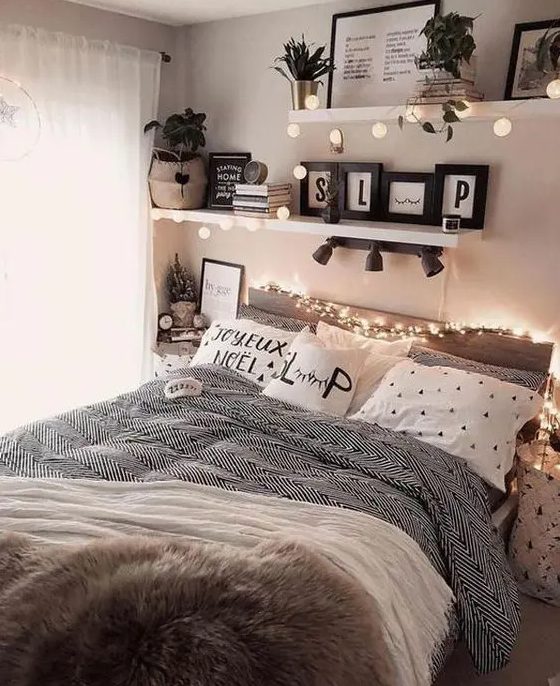 A cozy teenage girl's bedroom with a bed and printed bedding, shelves with lights and plants, books and magazines