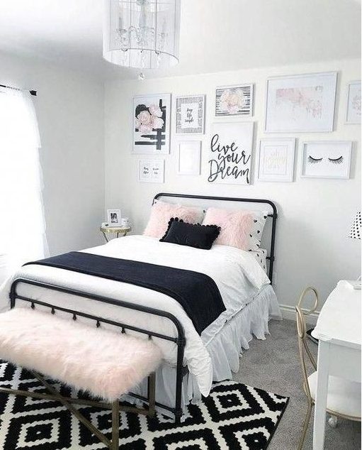 A girly teen bedroom in black, white and blush, with a cool gallery wall, printed textiles and brass accents
