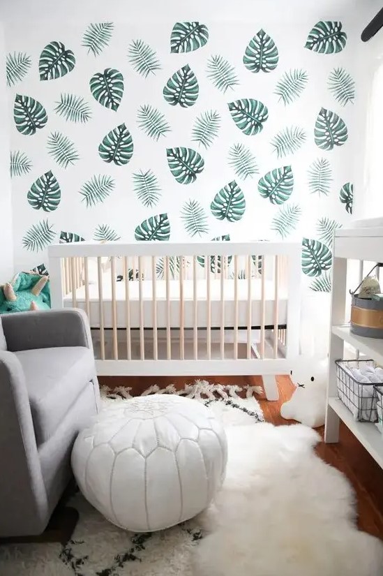 A leaf-patterned wall, faux fur, a white leather stool, and lots of natural light create a clean look in a small child's room