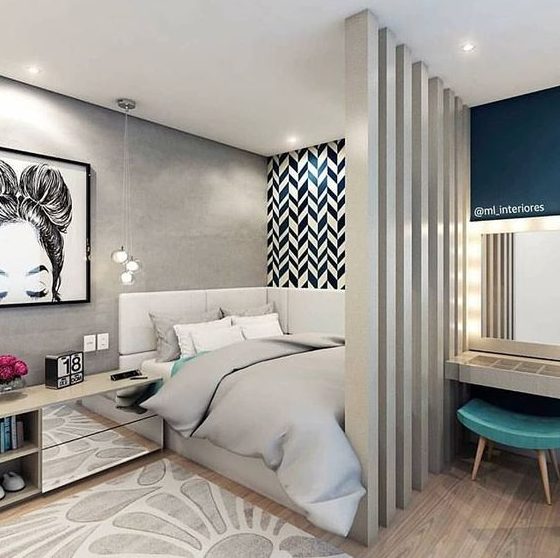 A modern gray and navy teenage girl's bedroom, with separate sleeping and study areas and lots of prints