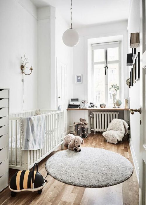 a small Scandinavian children's room with a white children's bed, a gallery wall, a windowsill with decorations, toys and a chest of drawers