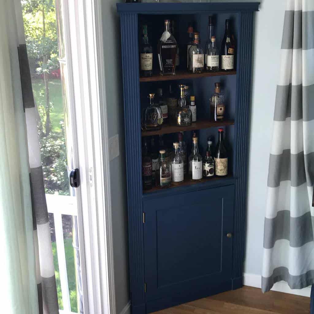 small blue corner liquor cabinet 