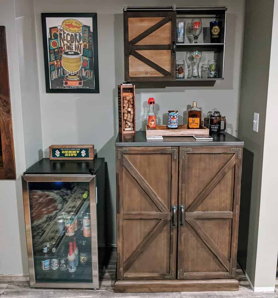 small bar fridge with wooden liquor cabinet