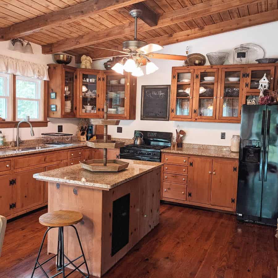 Rustic farmhouse kitchen with wooden cabinets and ceiling 