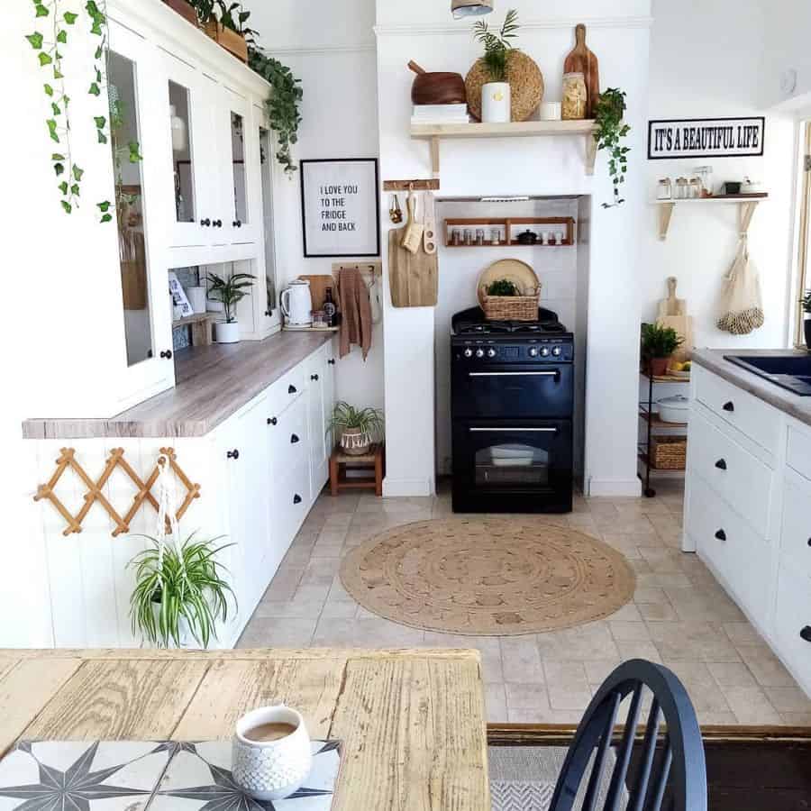 White rustic kitchen with cupboards and tiled floor