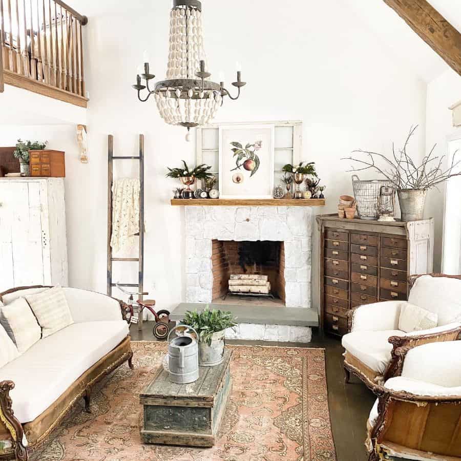 Rustic living room with white stone fireplace and chandelier