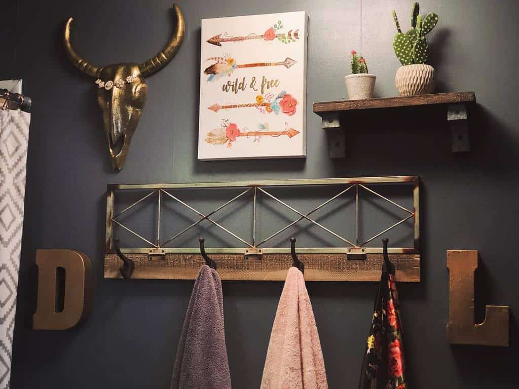 decorative wooden towel rack and wooden shelf with cactus
