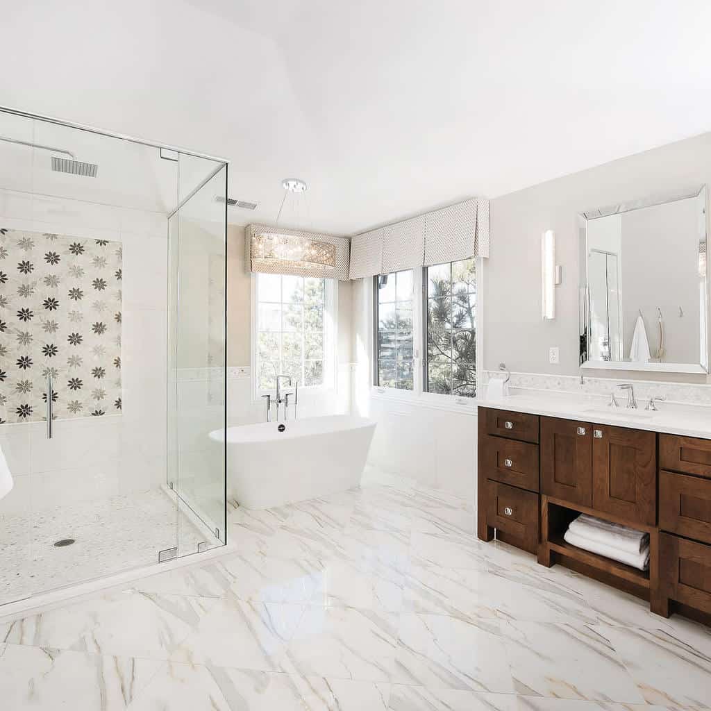 White bathroom with freestanding bathtub and wooden vanity 