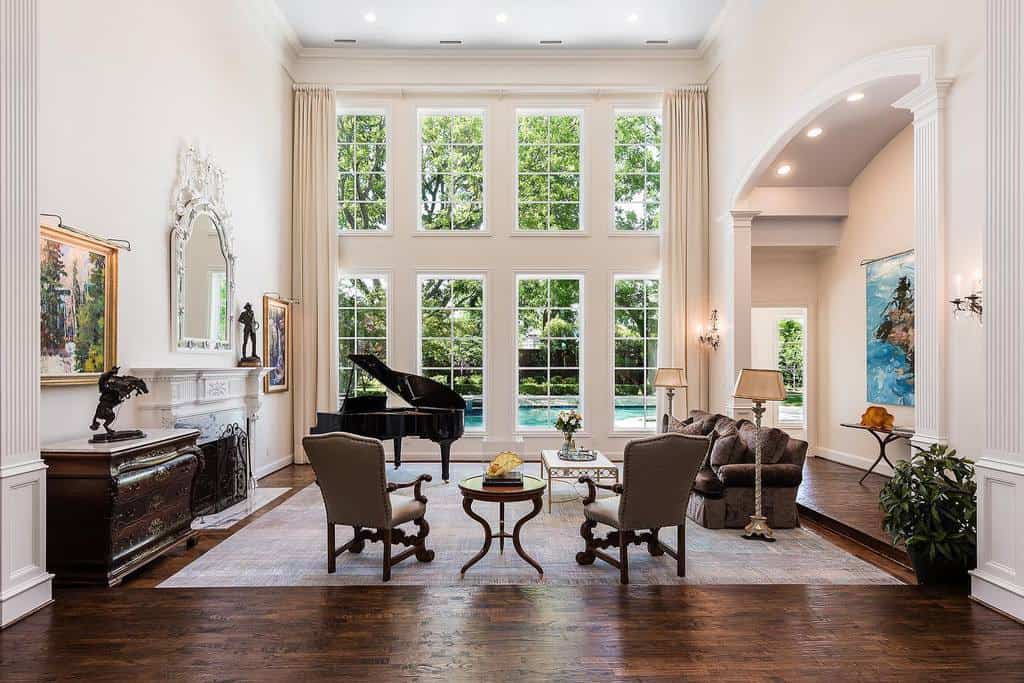 large living room with vintage furniture and grand piano 
