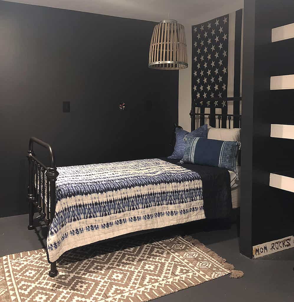 Black bedroom with American wall art