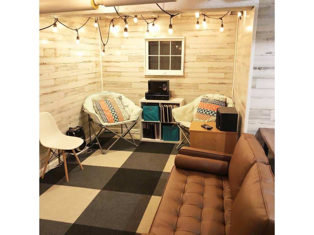 small basement room with low hanging lamps