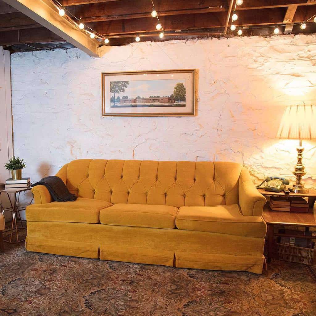 Mustard yellow couch in rustic living room