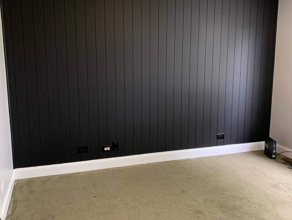 black wood panel walls