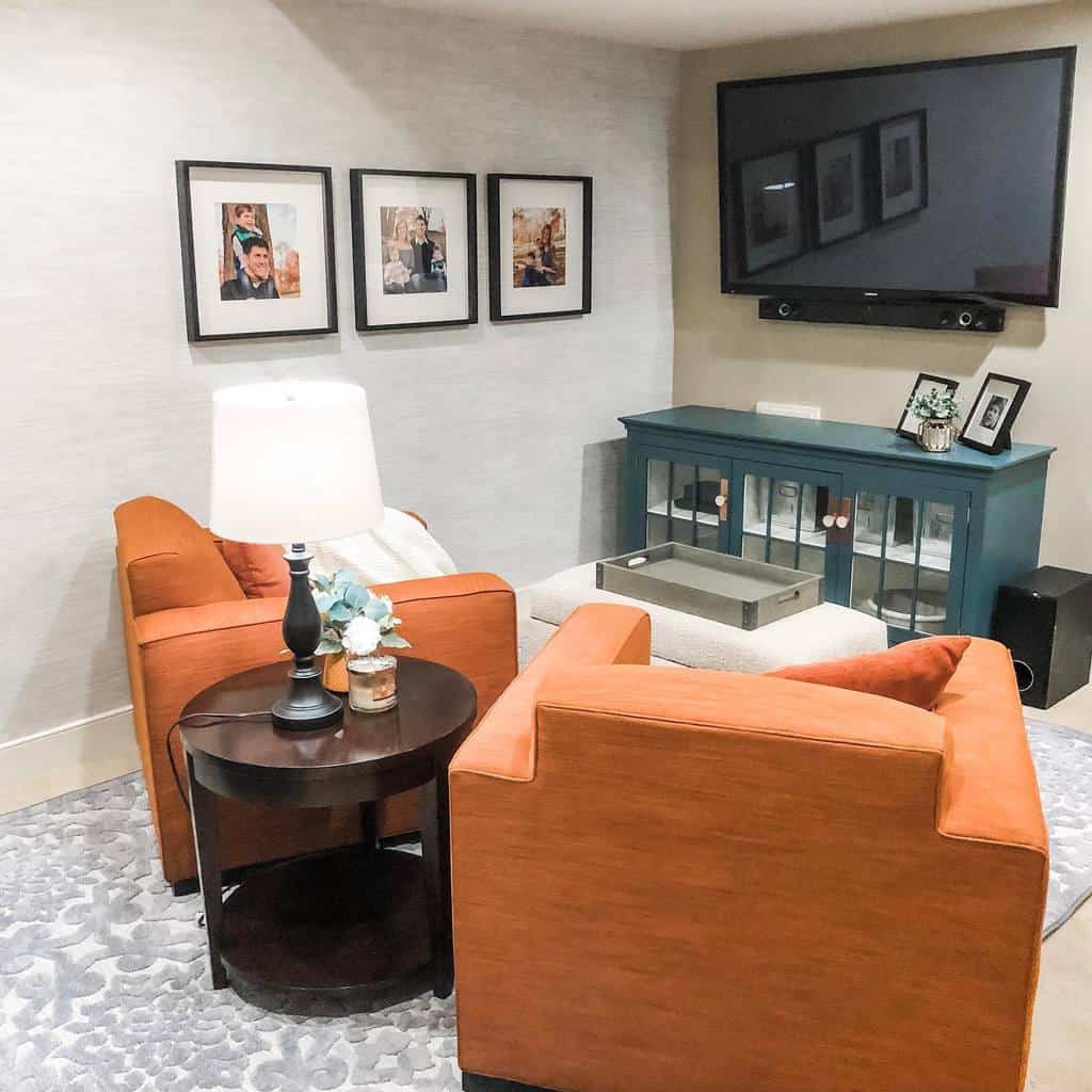 small living room with orange sofas