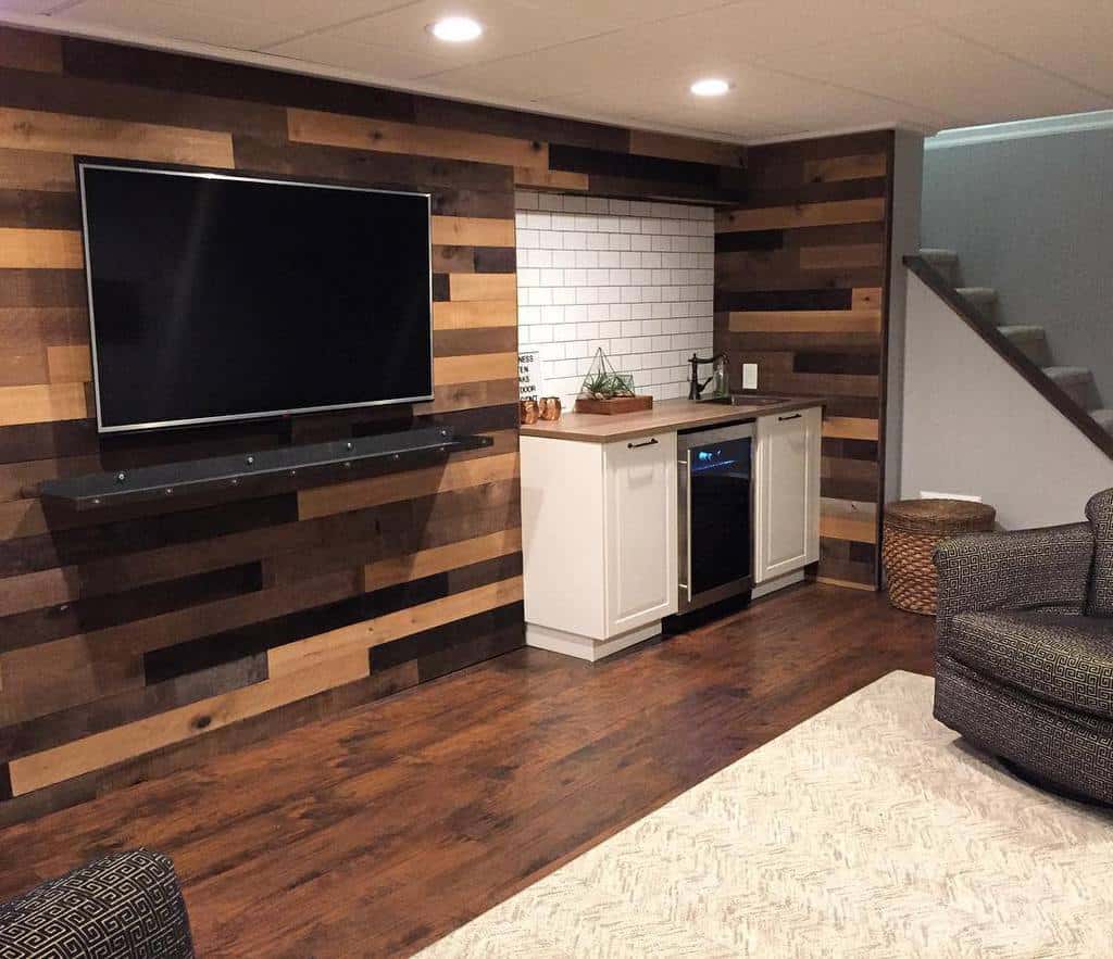 Living room in wooden basement with wall-mounted television