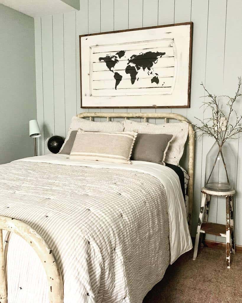 White bed with world map as a wall poster