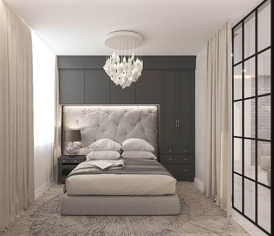 modern small bedroom with gray bed and cupboards 