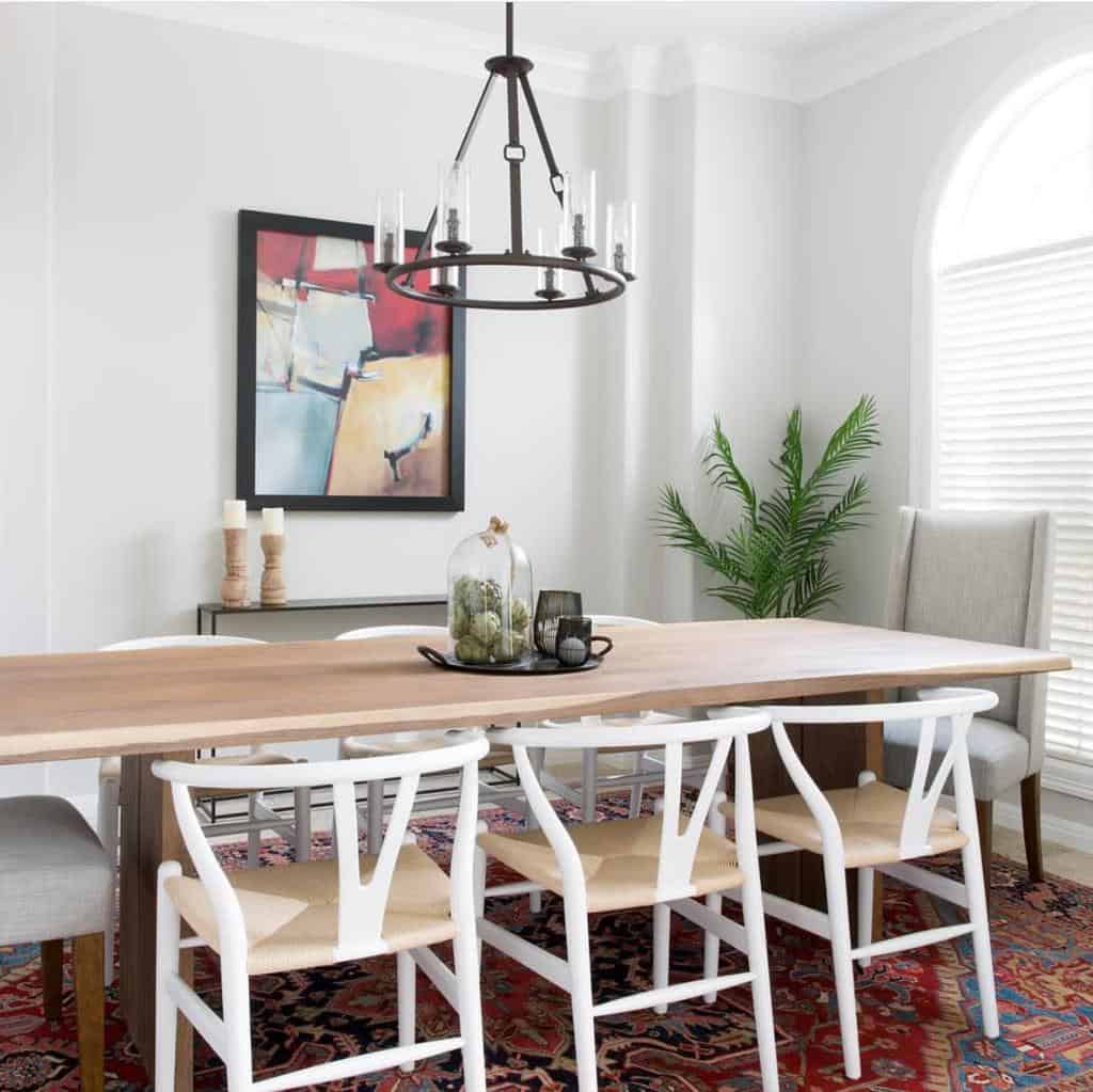 Minimalist dining room rug with long rectangular table and vintage chandelier