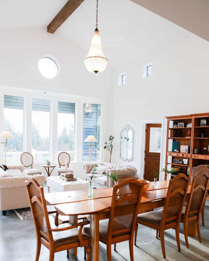 Country style living and dining room, wooden cupboard, dining table and chairs, chandelier