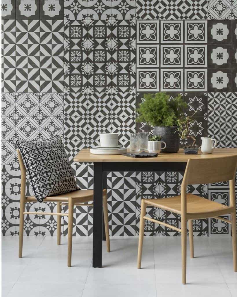 Pattern wallpaper, small table and two chairs, tiled floor