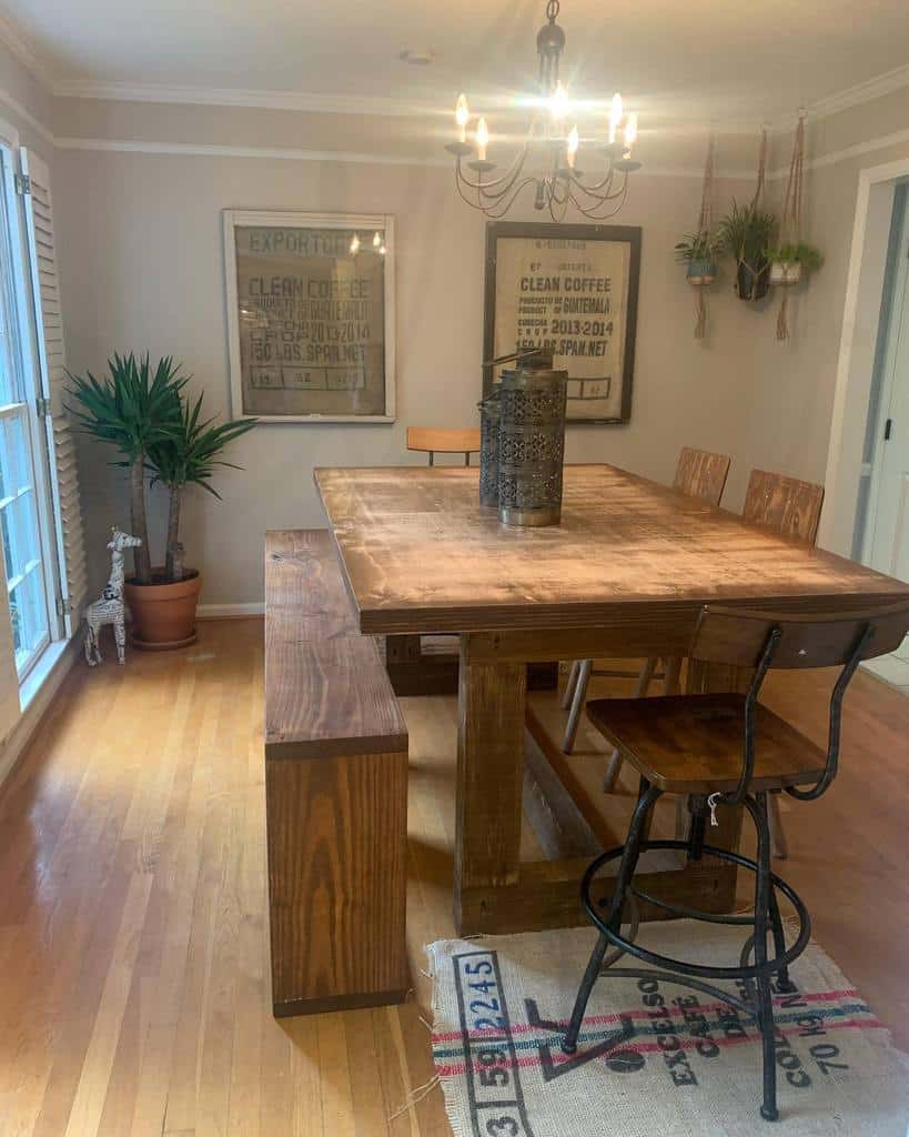 small rustic wooden dining room table, chairs and chandelier