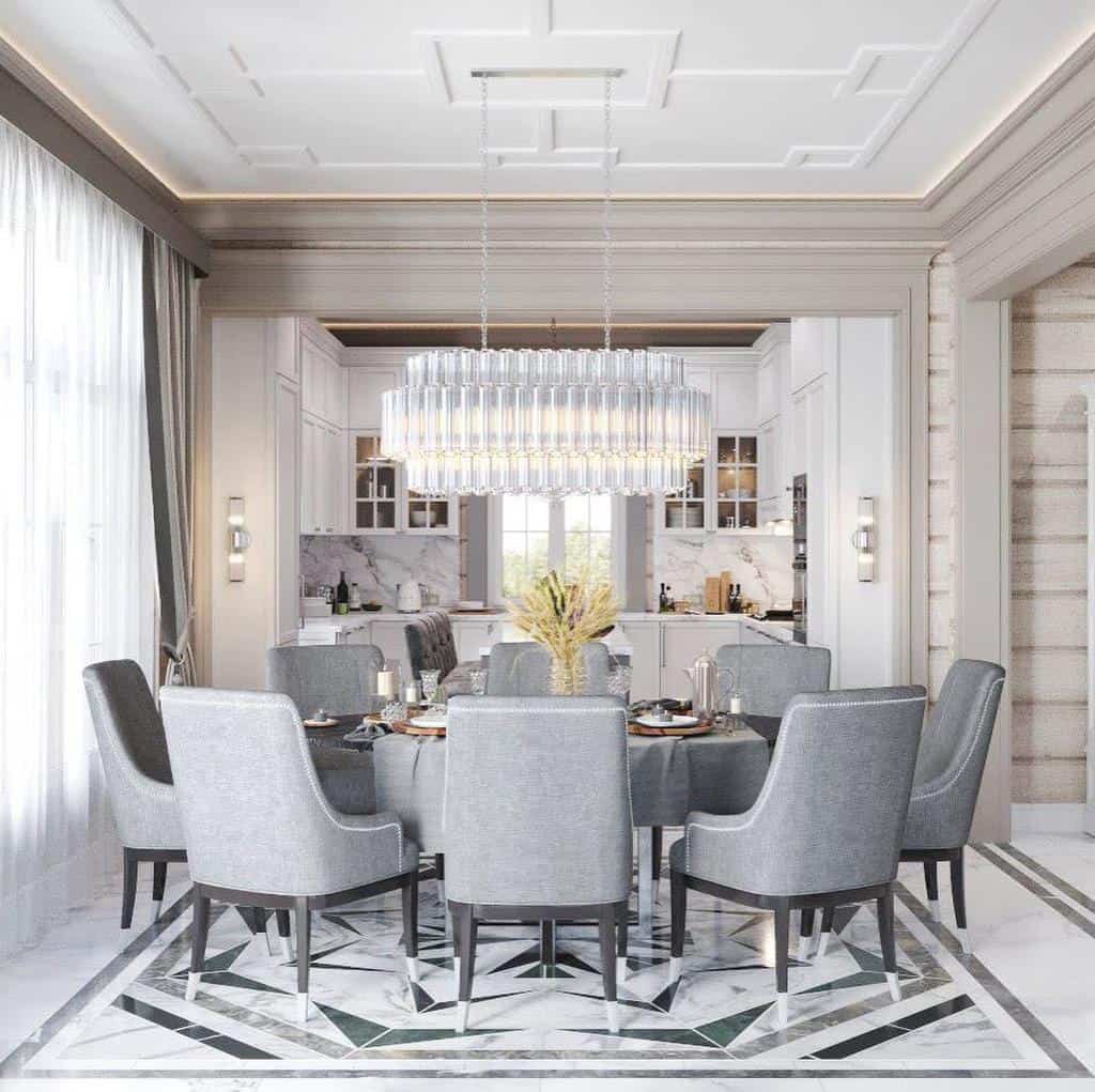 Luxury dining room, glass chandelier, gray table and chairs, marble kitchen