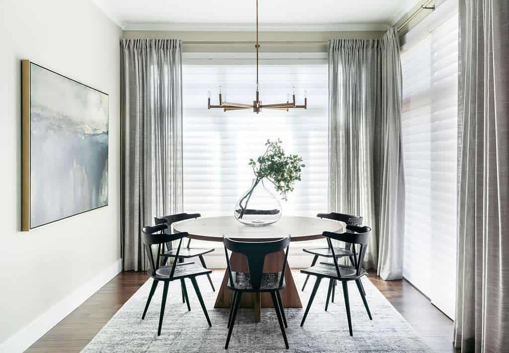 Modern dining room, gray curtains, round table with chairs, Sputnik chandelier