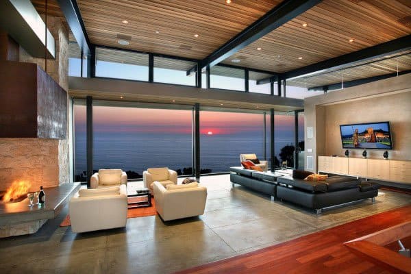 Luxurious open plan living room with fireplace and sea views