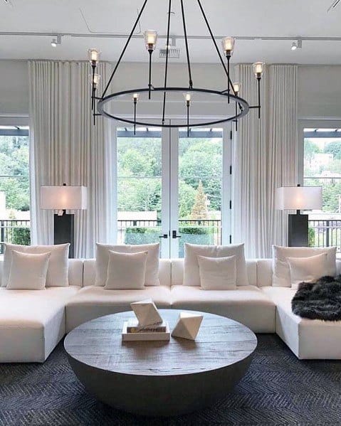 Modern luxury living room with white sofa and chandelier