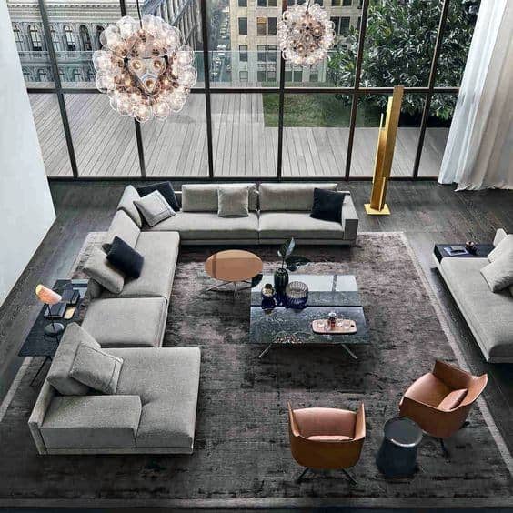 Luxury apartment living room with gray sofa and floor-to-ceiling windows 