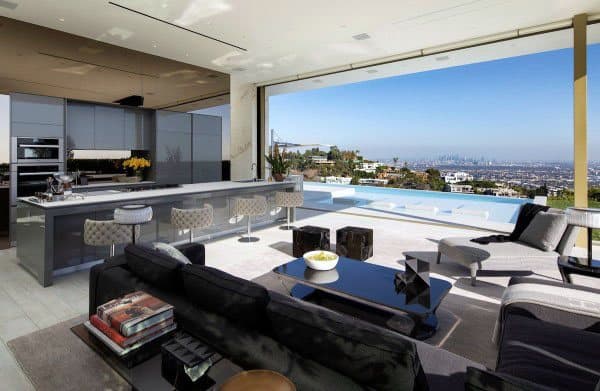 Luxurious living room with kitchen and city view