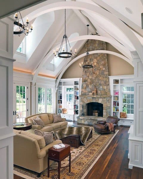 Traditional living room with vaulted roof and stone fireplace