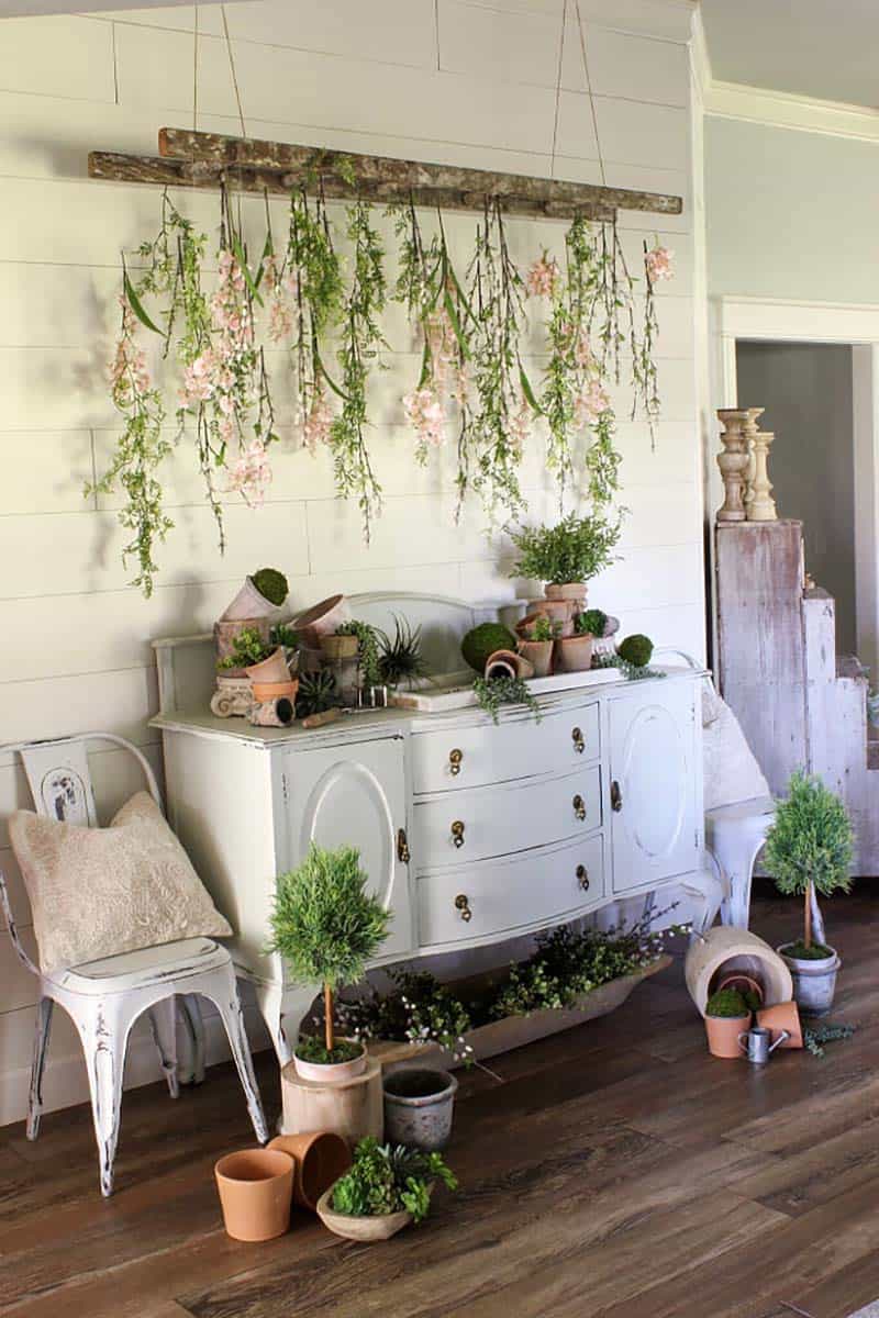 Spring-console-table-with-a-homemade-ladder-and-artificial-flowers