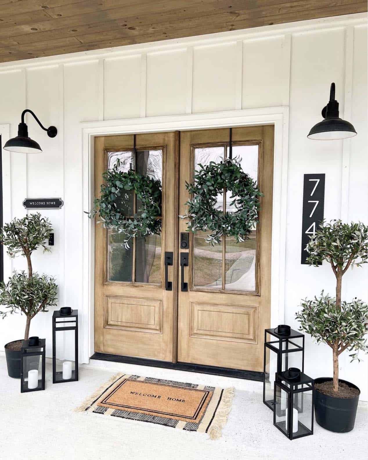 Spring porch with double olive topiary trees
