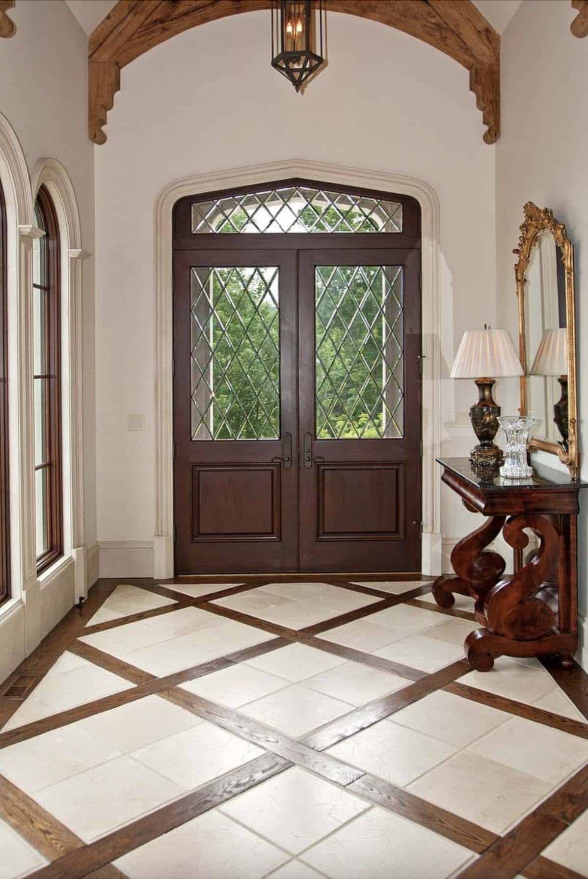 elegant foyer with criss-cross hardwood flooring and tile
