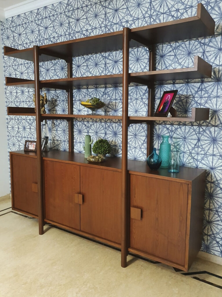 Mid-century modern large shelf with blue geometric wallpaper