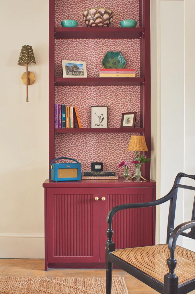 Burgundy shelves with red wallpaper in vintage style