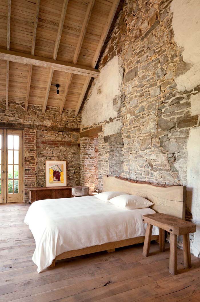 Artistic patched stone walls in the bedroom