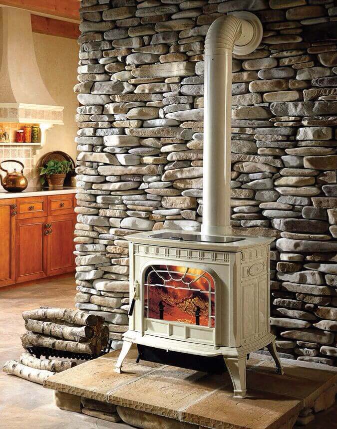 Rustic oven in front of a natural stone wall