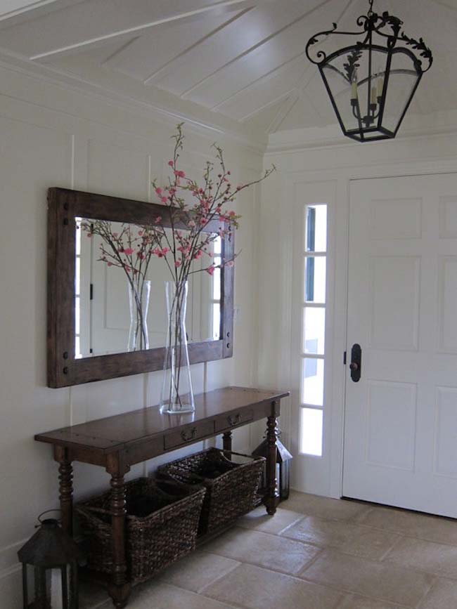 Rustic entrance ambience with a rectangular mirror
