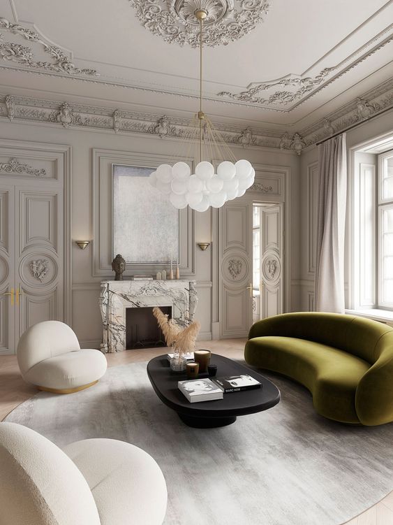 An exquisite room with an olive green curved sofa that adds color and memorable lines to the living room