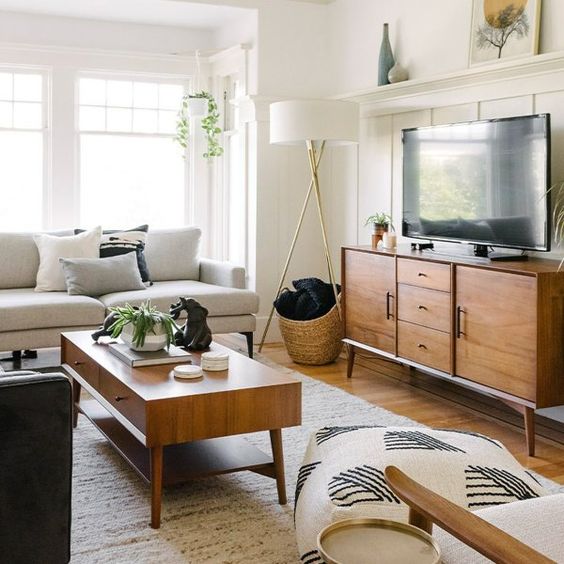 Stained mid-century modern furniture - a TV and a coffee table add chic and coziness to the living room