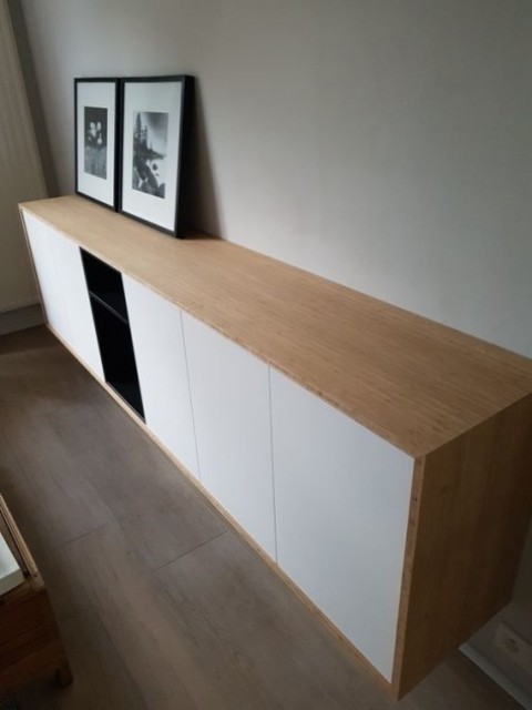 a chic, modern floating sideboard made from IKEA Metod cabinets and Tutema cabinets and a light stained wood top