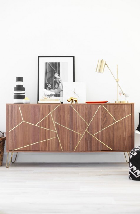 a Stockholm sideboard with gold hairpin legs and a geometric design made from gold foil ribbon