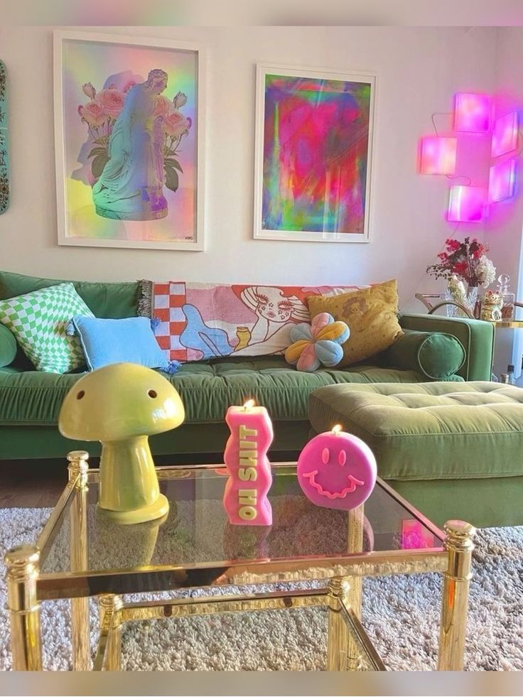 A living room with dopamine decor, a green sofa and ottoman, a clear coffee table, bright decor and a neon lamp