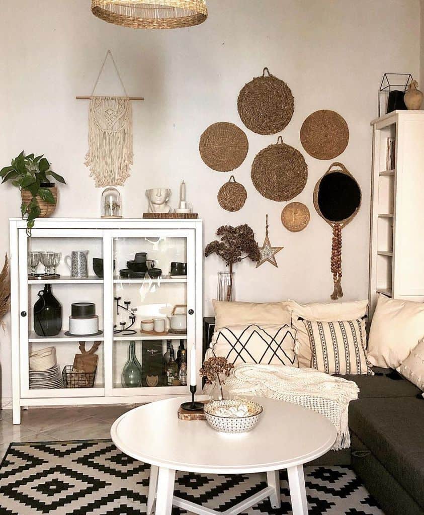 Boho living room wall art with white cabinet 