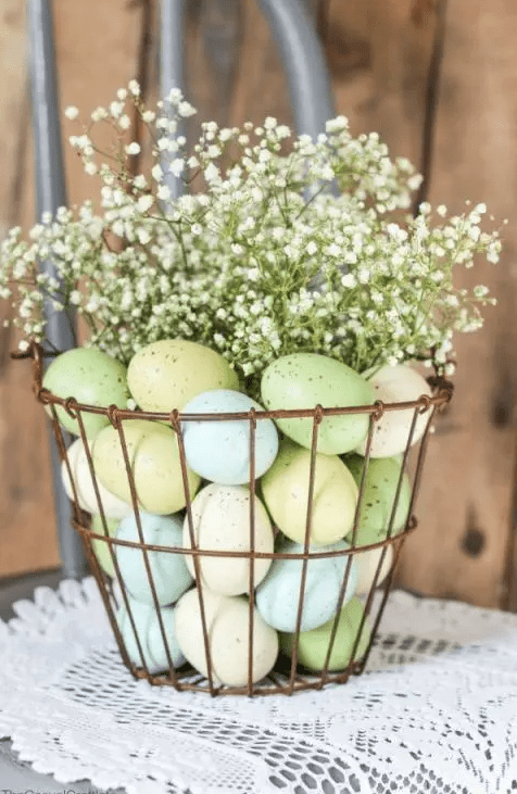 A copper wire basket with pastel eggs and baby's breath makes a cool arrangement or centerpiece for Easter