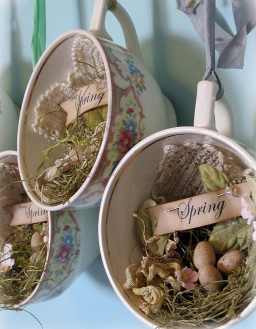 Vintage teacups with moss, artificial eggs, doilies, grass and dried flowers make beautiful vintage and rustic decorations