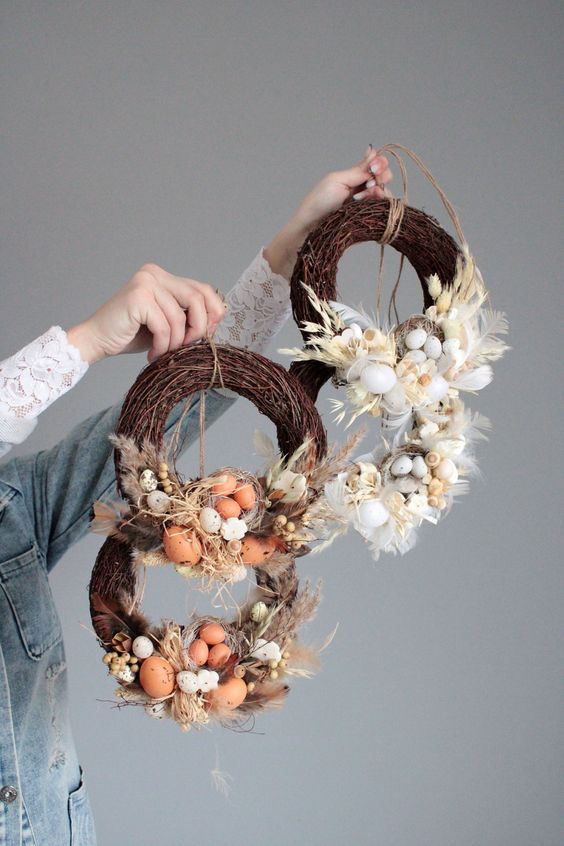 Rustic Easter wreaths made from vines, eggs, feathers, grasses and a nest are great for outdoor Easter decorations