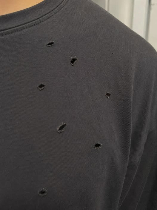 Common Reasons T-Shirts May Develop Small Holes Over Time